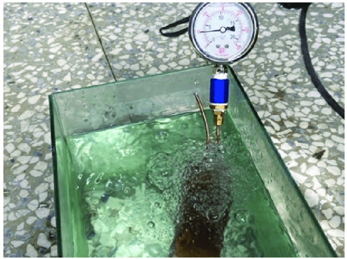 What causes pressure to increase in tank during leak test